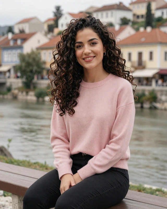 Lejla, 27, a Bosnian woman from Sarajevo sitting by a river